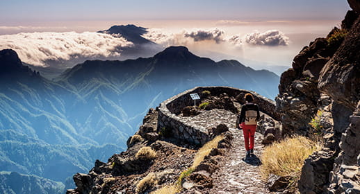 A person walking in Caldera de Taburiente National Park, La Palma, Canary Islands A person walking in Caldera de Taburiente National Park, La Palma, Canary Islands