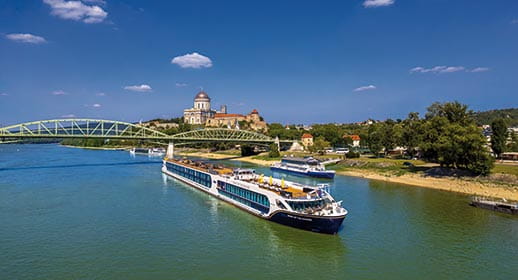Spirit of the Danube sailing past the Esztergom Basilica in Hungary Spirit of the Danube sailing past the Esztergom Basilica in Hungary