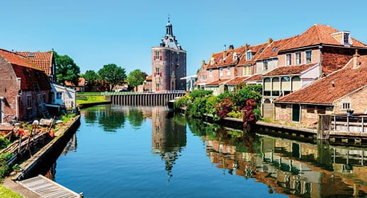 A view down a canal in Enkhuizen, Netherlands A view down a canal in Enkhuizen, Netherlands