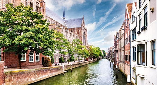 A view down a canal in Dordrecht, Netherlands A view down a canal in Dordrecht, Netherlands