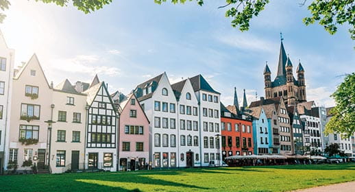 Colourful houses and St Martin's Church in Cologne, Germany Colourful houses and St Martin's Church in Cologne, Germany