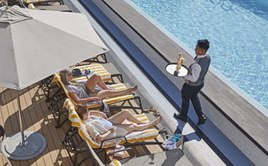 Friends relaxing by the Lido on Spirit of Adventure