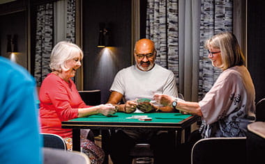 Guests playing games in the Card Room on Spirit of Adventure