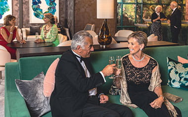 Guests enjoying drinks in the Living Room on Spirit of Adventure