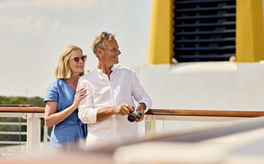People enjoying the view from the Sun Deck on Spirit of Adventure