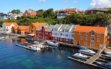 A view of houses and boats during the summer in Haugesund, Norway