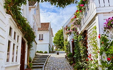 A cobbled street in Stavanger lined with white houses, Norway