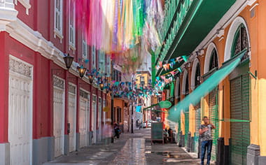 A view down a colourful street in Callao, Peru