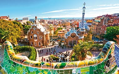 The architecture of Parc Guell in Barcelona, covered in mosaic tiles, Spain