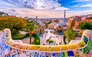 The architecture of Parc Guell in Barcelona, covered in mosaic tiles, Spain