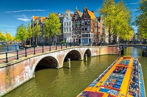 A glass topped tourist boat on the canals of Amsterdam