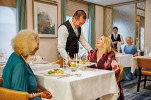 Women enjoying dinner in Coast to Coast on Spirit of Discovery