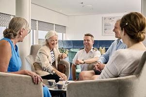 Captain Tanner speaking with guests on board