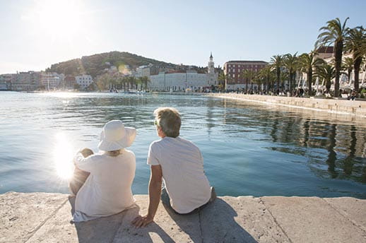 A couple sitting at the waterfront of Split