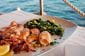 Traditionally grilled squid with boiled potatoes and chard (blitva)