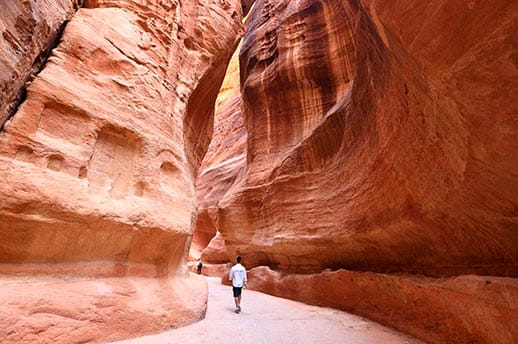 The Siq, a narrow slot-like canyon serves as the entrance to the hidden city of Petra