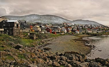Jetty from rocks at the harbor entrance, behind the village, Honningsvåg, Magerøya island