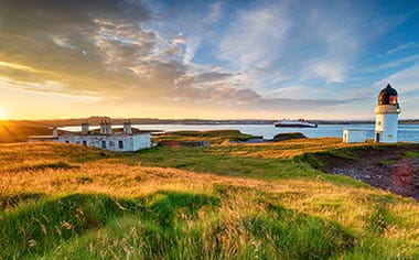 Sunset over Stornoway lighthouse on the Isle of Lewis in the Outer Hebrides of Scotland